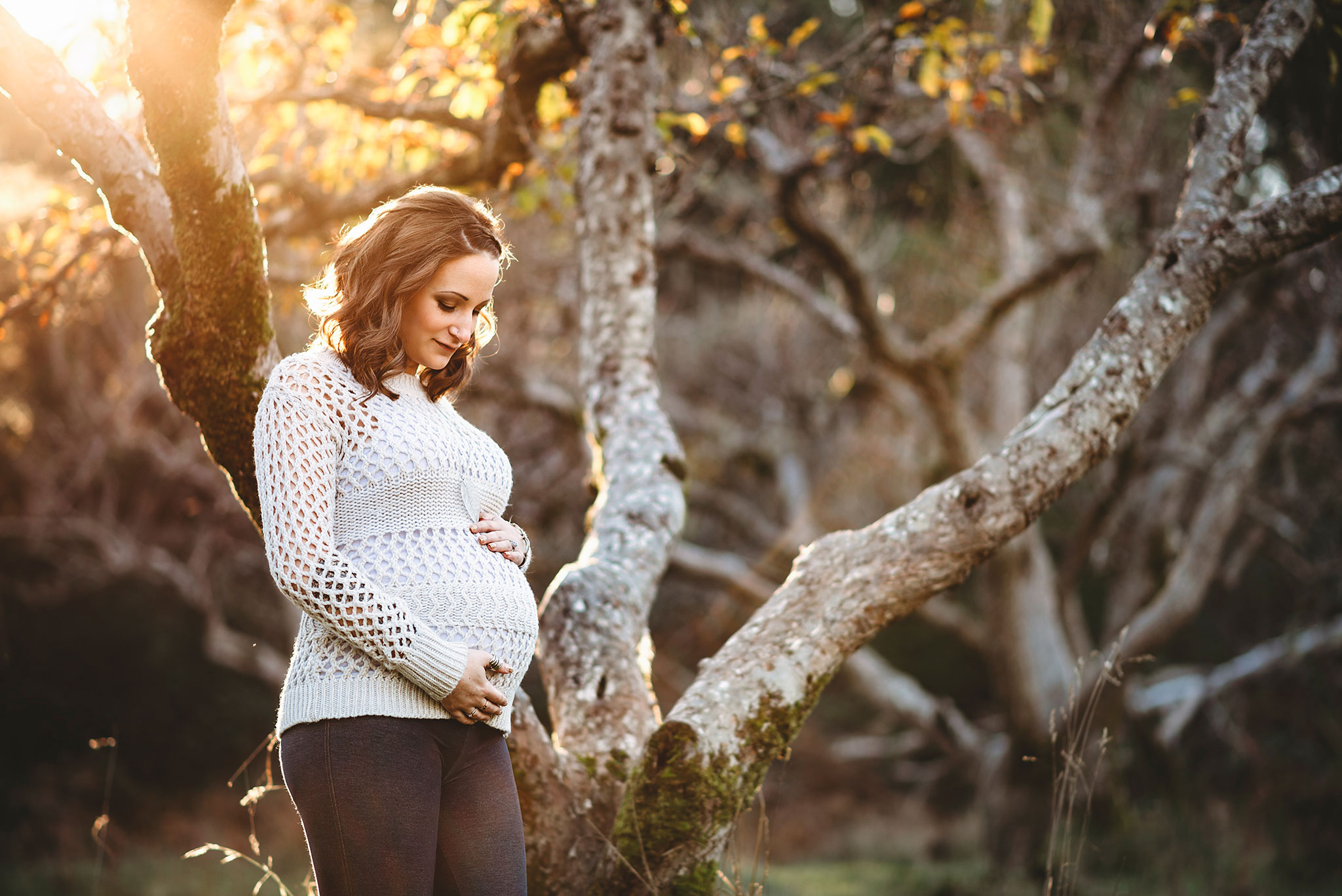 Fall maternity photography in a cozy sweater at sunset in East Sooke Park near Victoria.